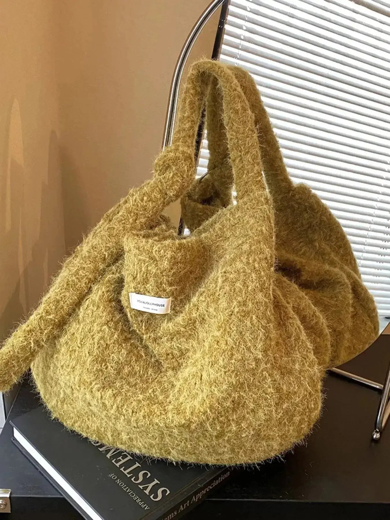 Fuzzy solid color crossbody bag from Plush Fashion Hub with plush texture and slim strap, perfect for casual wear.
