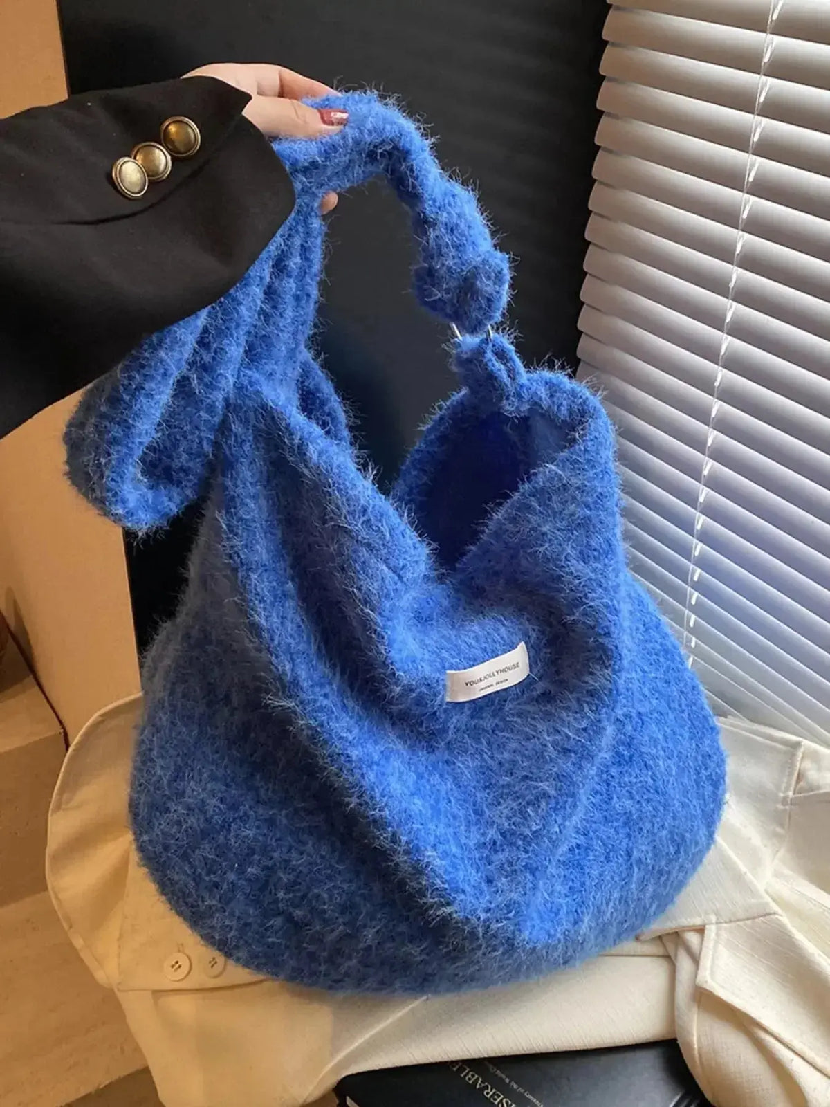 Soft fuzzy solid color crossbody bag by Plush Fashion Hub with a plush texture, zipper closure, and adjustable strap.
