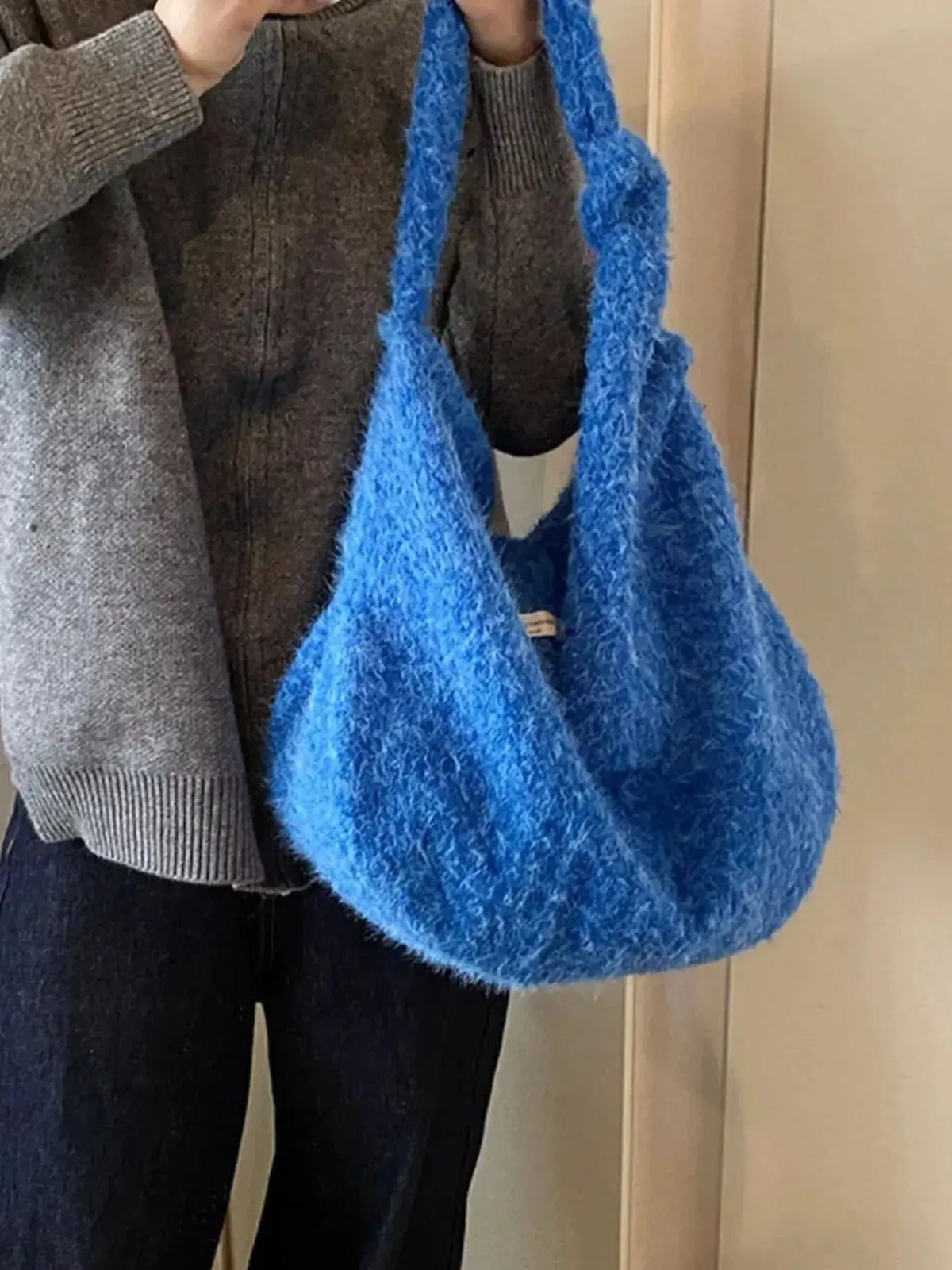Soft fuzzy solid color crossbody bag by Plush Fashion Hub, featuring a plush texture and compact design for casual wear.