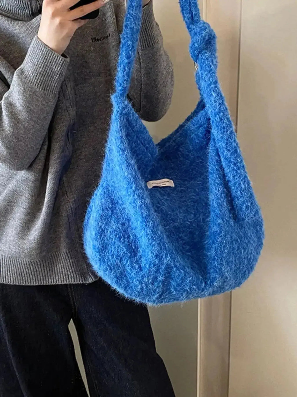 Fuzzy solid color plush crossbody bag from Plush Fashion Hub, featuring a soft, plush texture and compact design.