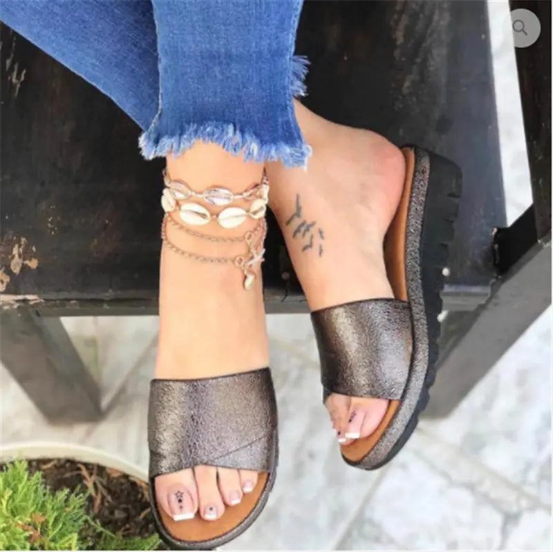 Comfortable wedge heel women's sandals with mid-height design and stylish straps, perfect for casual summer wear.