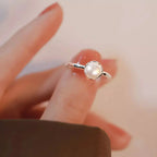 Sterling silver adjustable open ring featuring a genuine freshwater pearl, designed by Trendsi.