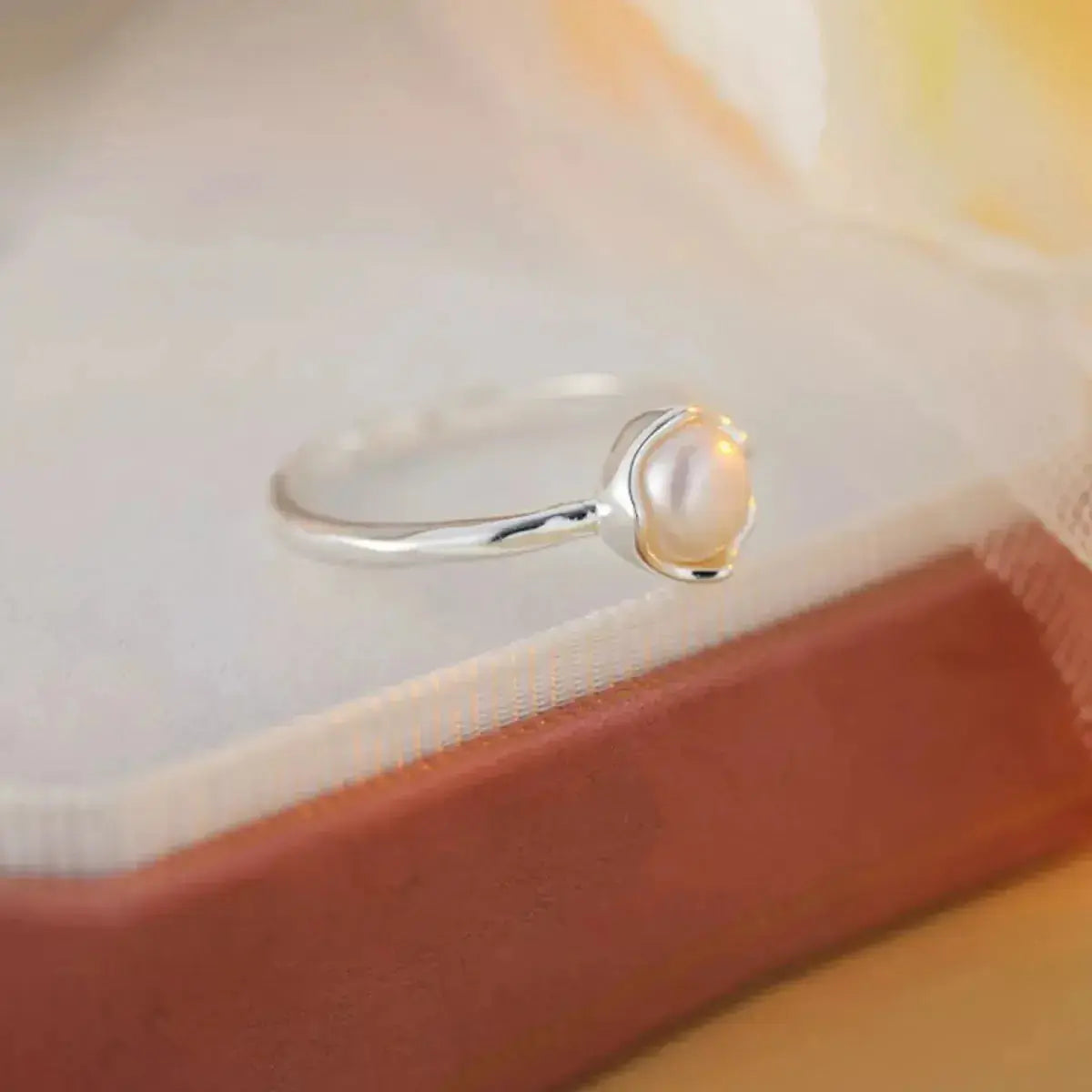 Sterling silver open ring with a genuine freshwater pearl, adjustable design, from Plush Fashion Hub.