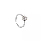 Sterling silver adjustable open ring with a genuine freshwater pearl, featuring a sleek, elegant design.