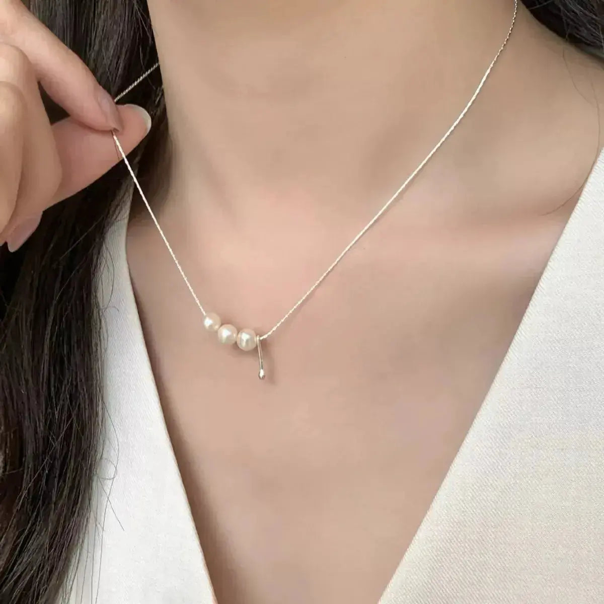 Genuine freshwater pearl pendant necklace with sterling silver chain, elegant jewelry piece from Plush Fashion Hub.