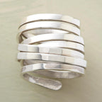 Silver-tone geometric winding hoop ring with modern design, crafted by Plush Fashion Hub, showcasing a bold jewelry statement piece.
