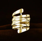 Silver-tone geometric winding hoop ring with modern metal design, featuring bold, abstract shapes from Plush Fashion Hub.