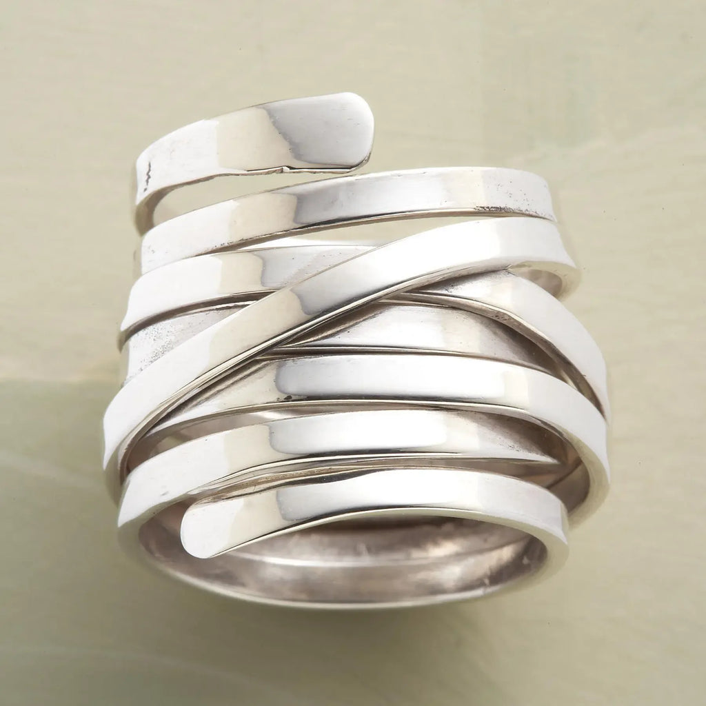 Silver-tone geometric winding hoop ring with modern design, crafted by Plush Fashion Hub, showcasing contemporary jewelry style.
