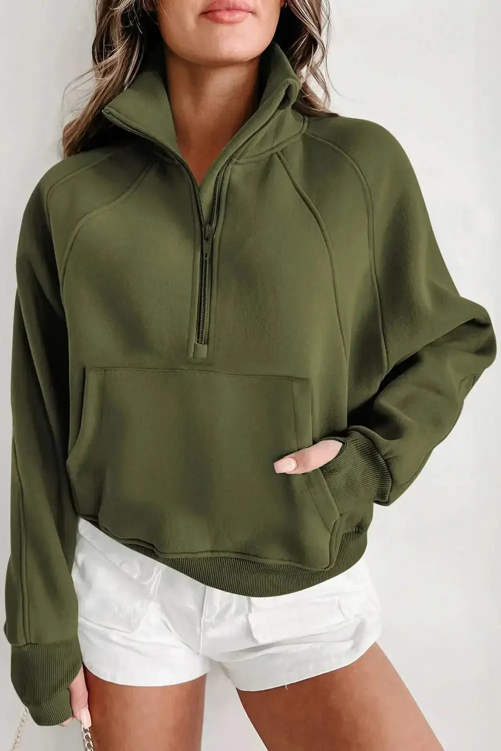 Women's green ribbed zip stand-collar sweatshirt with thumbhole sleeves by Plush Fashion Hub, casual and stylish for everyday wear.