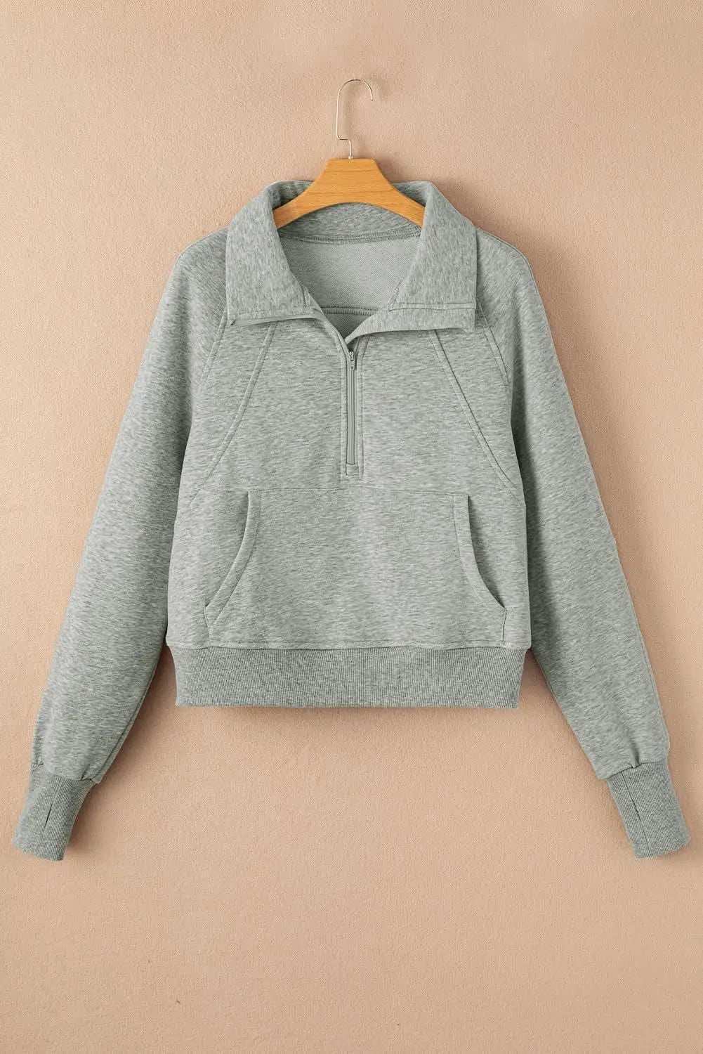 Women's green ribbed zip-up sweatshirt with stand collar and thumbhole sleeves, by Plush Fashion Hub.