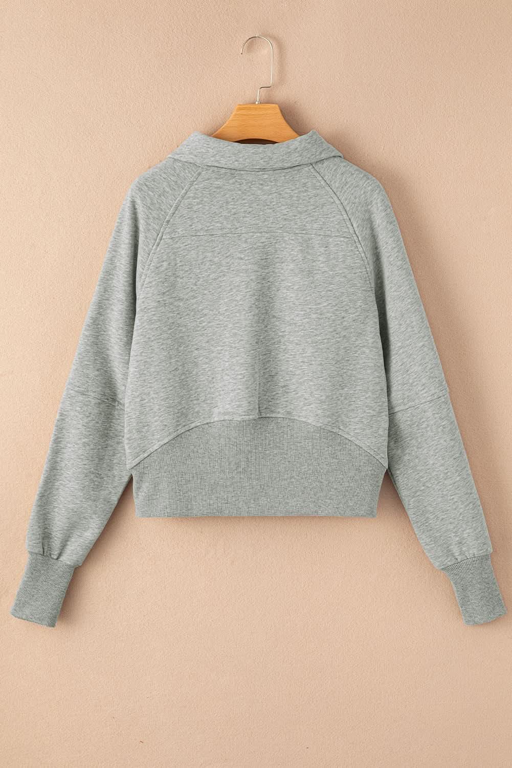 Women's green ribbed zip-up sweatshirt with stand collar and thumbhole sleeves by Plush Fashion Hub.