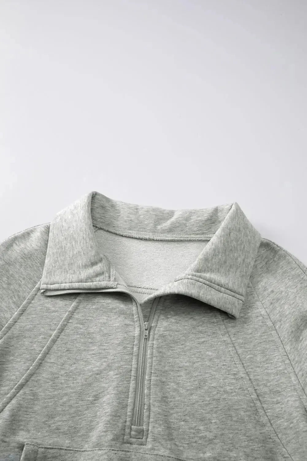 Women's green ribbed zip stand-collar sweatshirt with thumbhole sleeves from Plush Fashion Hub, casual and stylish for everyday wear.