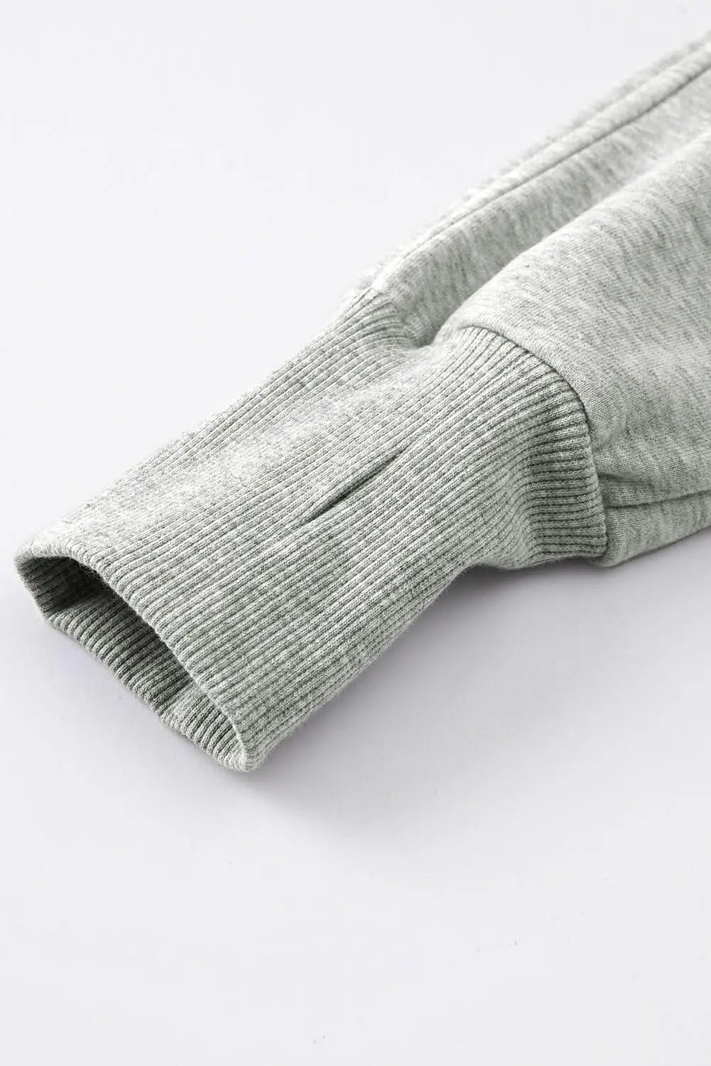 Women's green ribbed zip stand-collar sweatshirt with thumbhole sleeves from Plush Fashion Hub, casual and comfortable for everyday wear.
