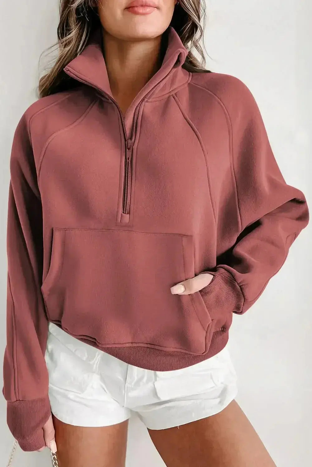 Women's green ribbed zip stand-collar sweatshirt with thumbhole sleeves from Plush Fashion Hub, casual and cozy fashion piece.