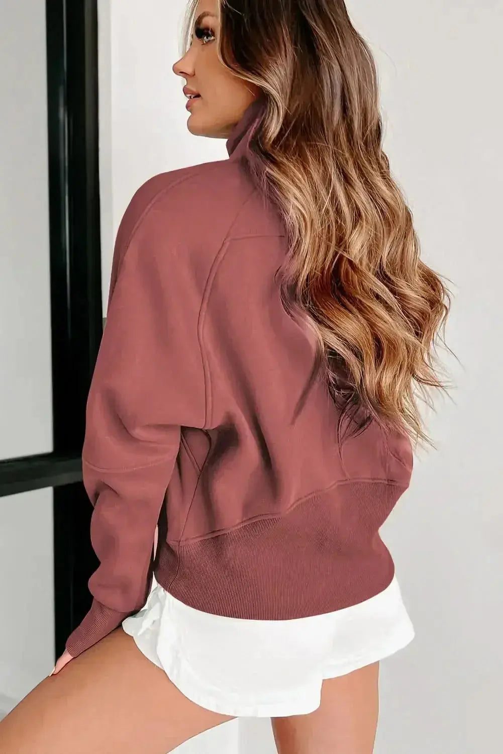 Green ribbed zip stand-collar sweatshirt for women by Plush Fashion Hub, featuring thumbhole sleeves and a cozy fit.