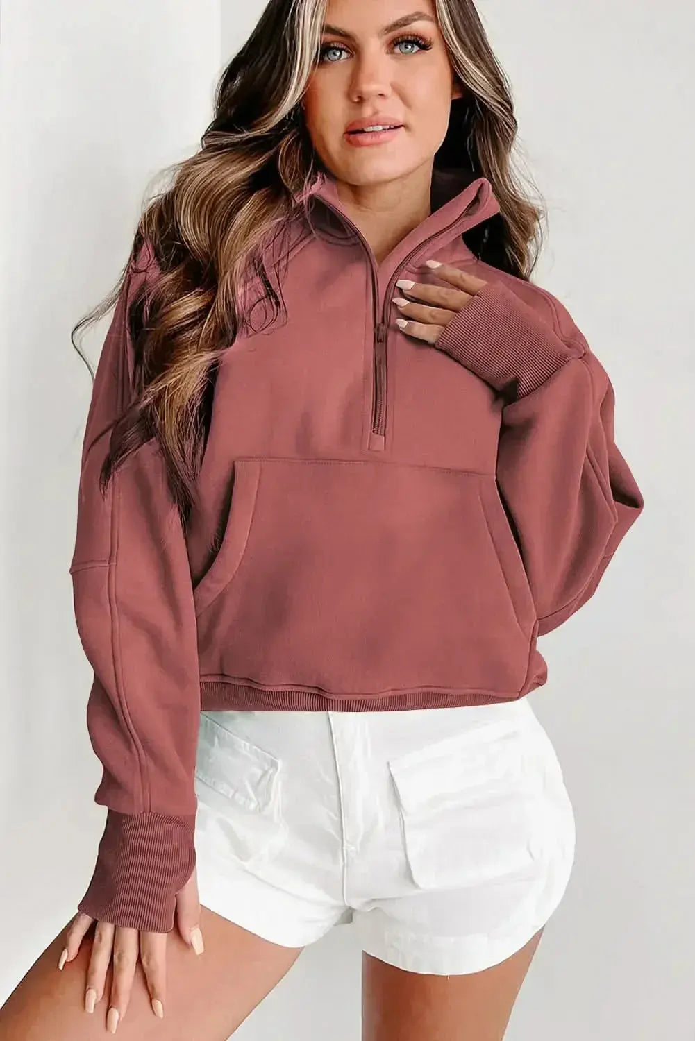 Women's green ribbed zip stand-collar sweatshirt with thumbhole sleeves from Plush Fashion Hub, cozy and stylish for casual wear.