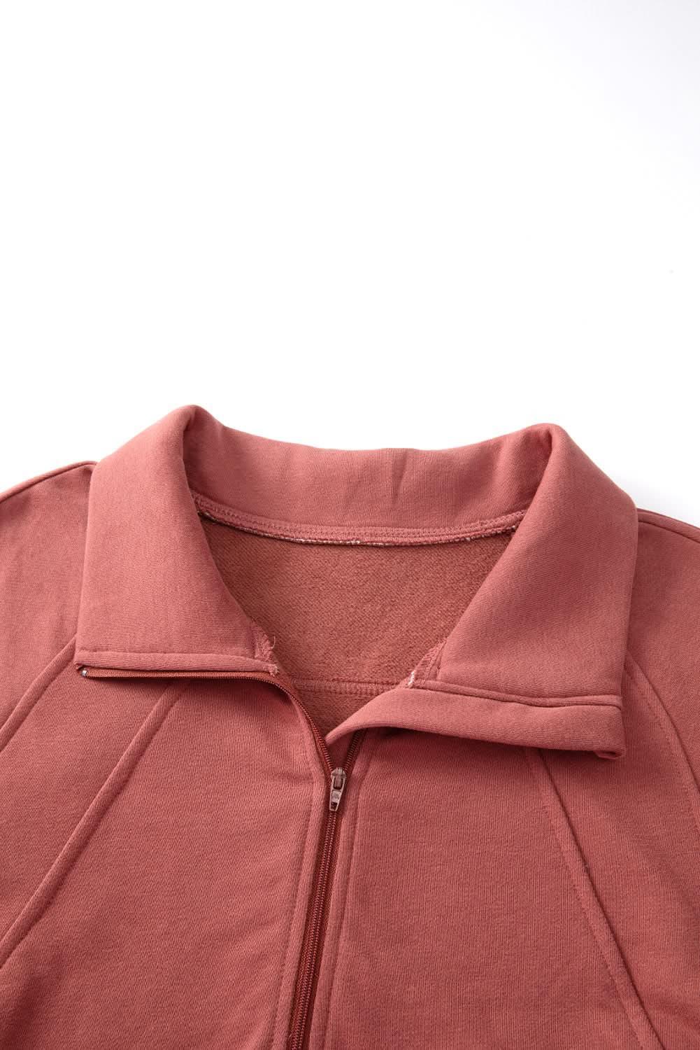 Women's green ribbed zip-up sweatshirt with stand collar and thumbhole sleeves from Plush Fashion Hub.