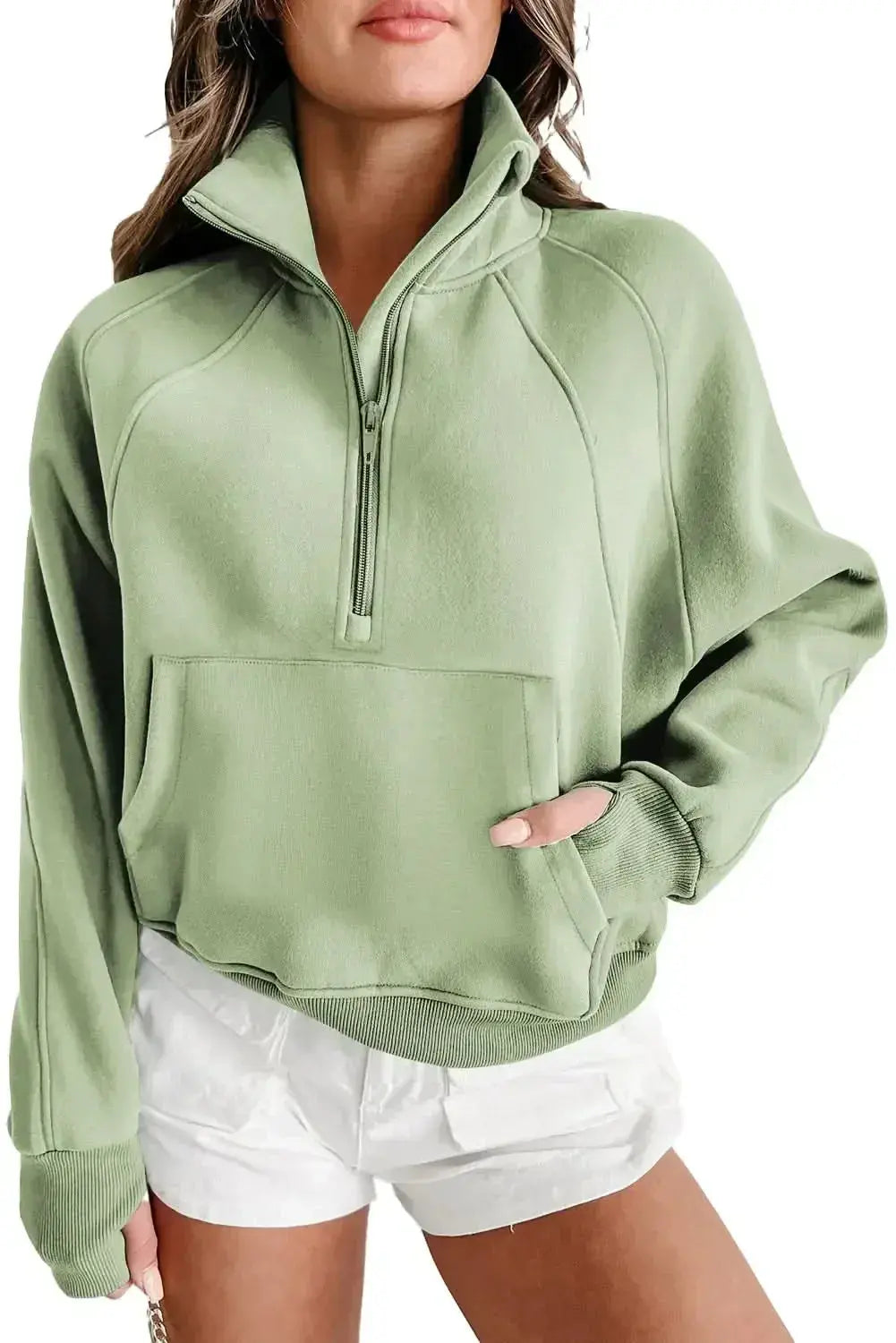 Green ribbed women's zip sweatshirt with stand collar and thumbhole sleeves from Plush Fashion Hub.