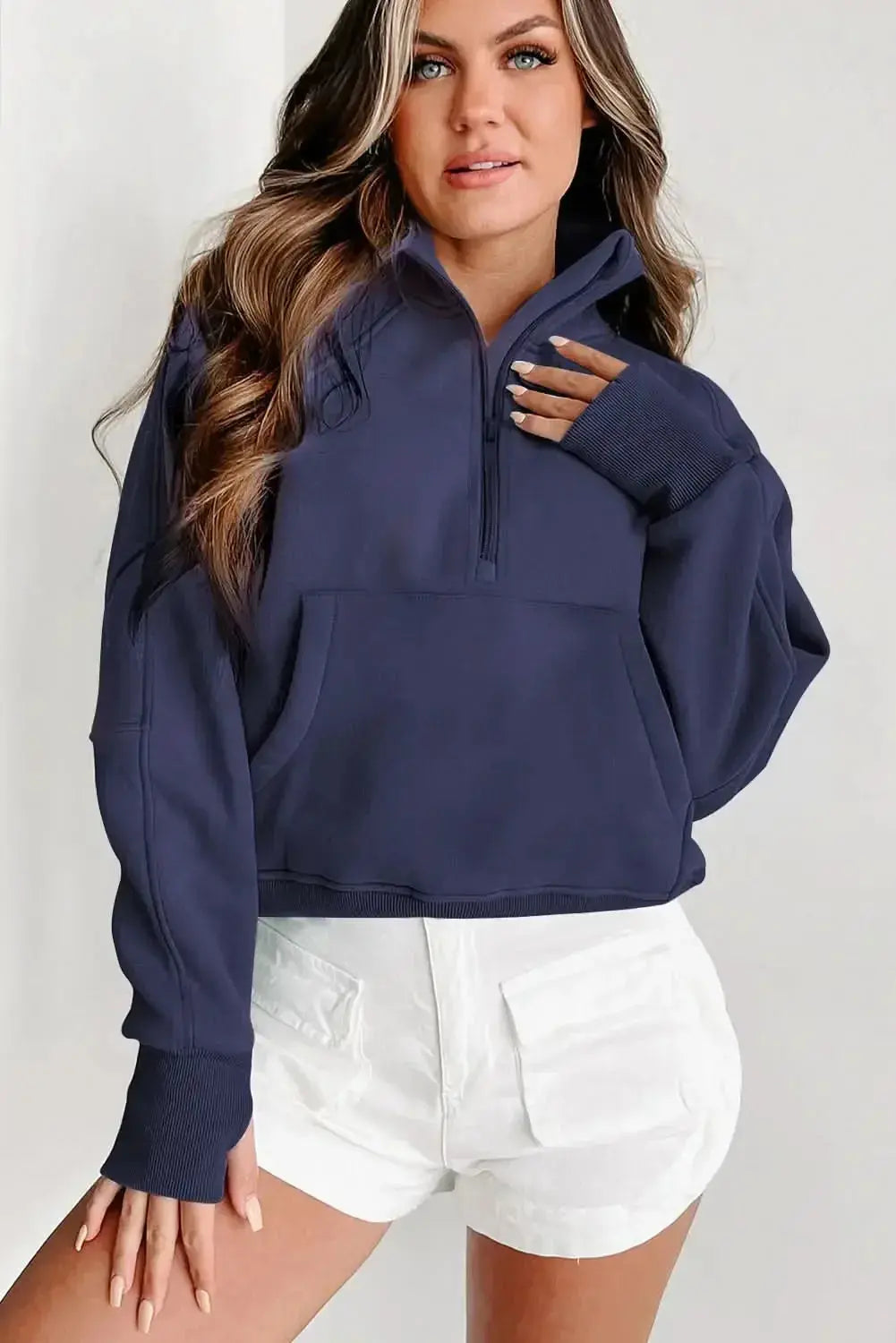 Women’s green ribbed zip-up sweatshirt with stand collar and thumbhole sleeves, by Plush Fashion Hub.