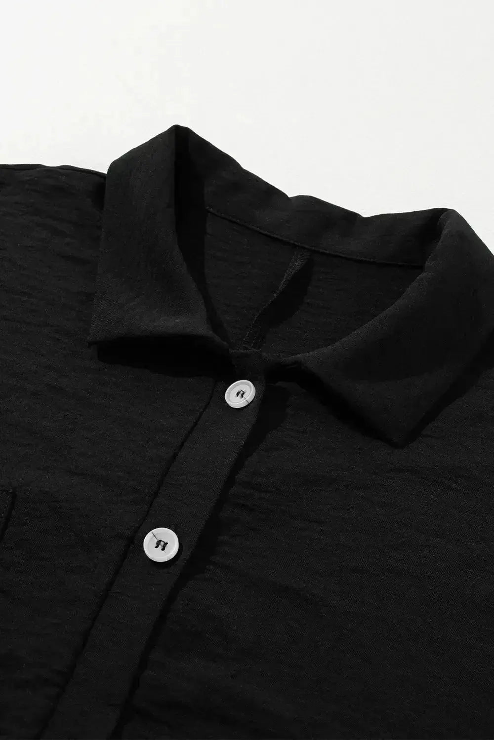 Women's lightweight collared shirt romper with half-button front, short sleeves, and relaxed fit, by Plush Fashion Hub.
