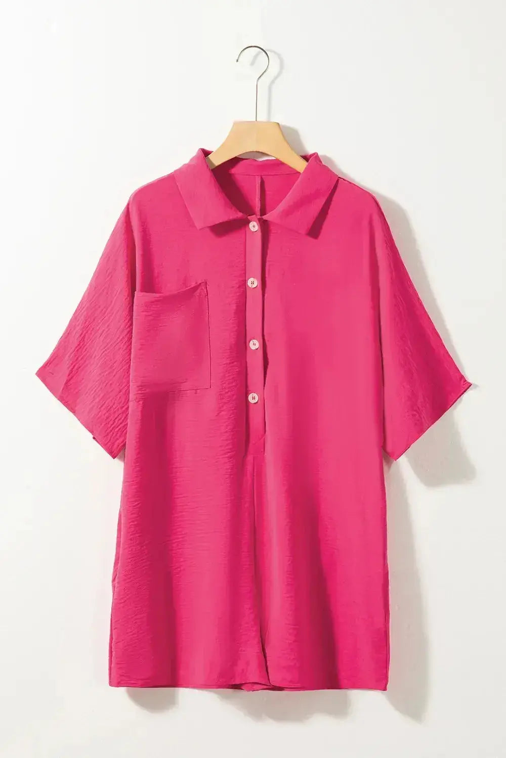 Women's lightweight collared shirt romper with half-button front and short sleeves, stylish and comfortable for warm weather.