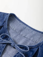 High-waist puff sleeve denim mini dress made from soft cotton blend, perfect for casual summer wear.