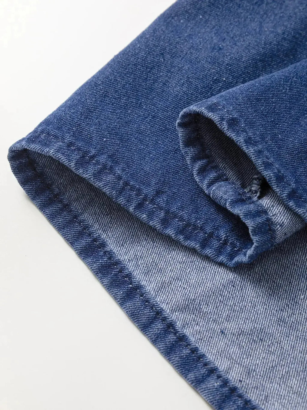 High-waist puff sleeve denim mini dress by Trendsi, made from soft cotton blend, perfect for casual summer wear.