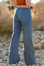 High-waisted wide-leg denim jeans with button front by Trendsi, featuring classic blue wash and relaxed fit.