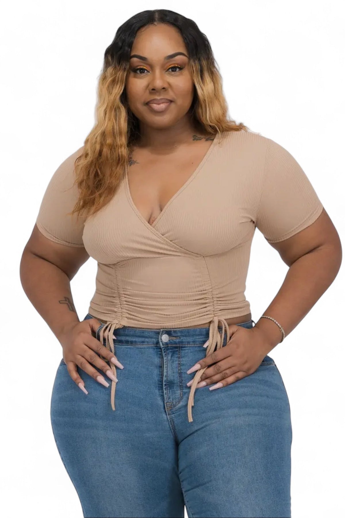 Curvy ribbed ruched drawstring surplice top by Plush Fashion Hub, featuring a fitted design with ruched details and a V-neck neckline.