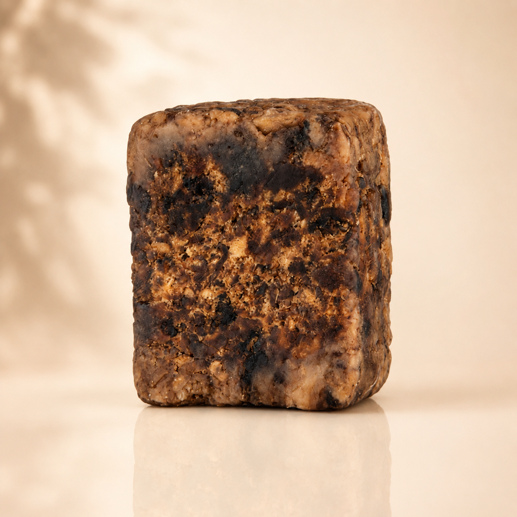 Raw African Black Soap from Timeless Organics Skin Care, natural beauty soap bar with dark, textured surface for clear skin.