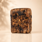 Raw African Black Soap from Timeless Organics Skin Care, natural beauty soap bar with dark, textured surface for clear skin.