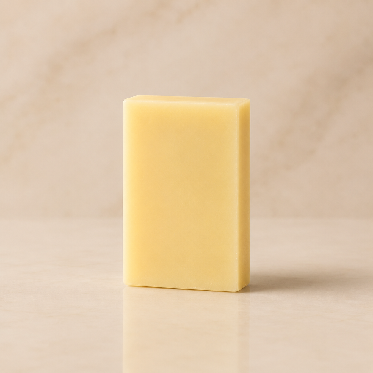 White Tea + Ginger shave bar soap by Timeless Organics Skin Care with white and ginger-colored soap bar on a neutral background.