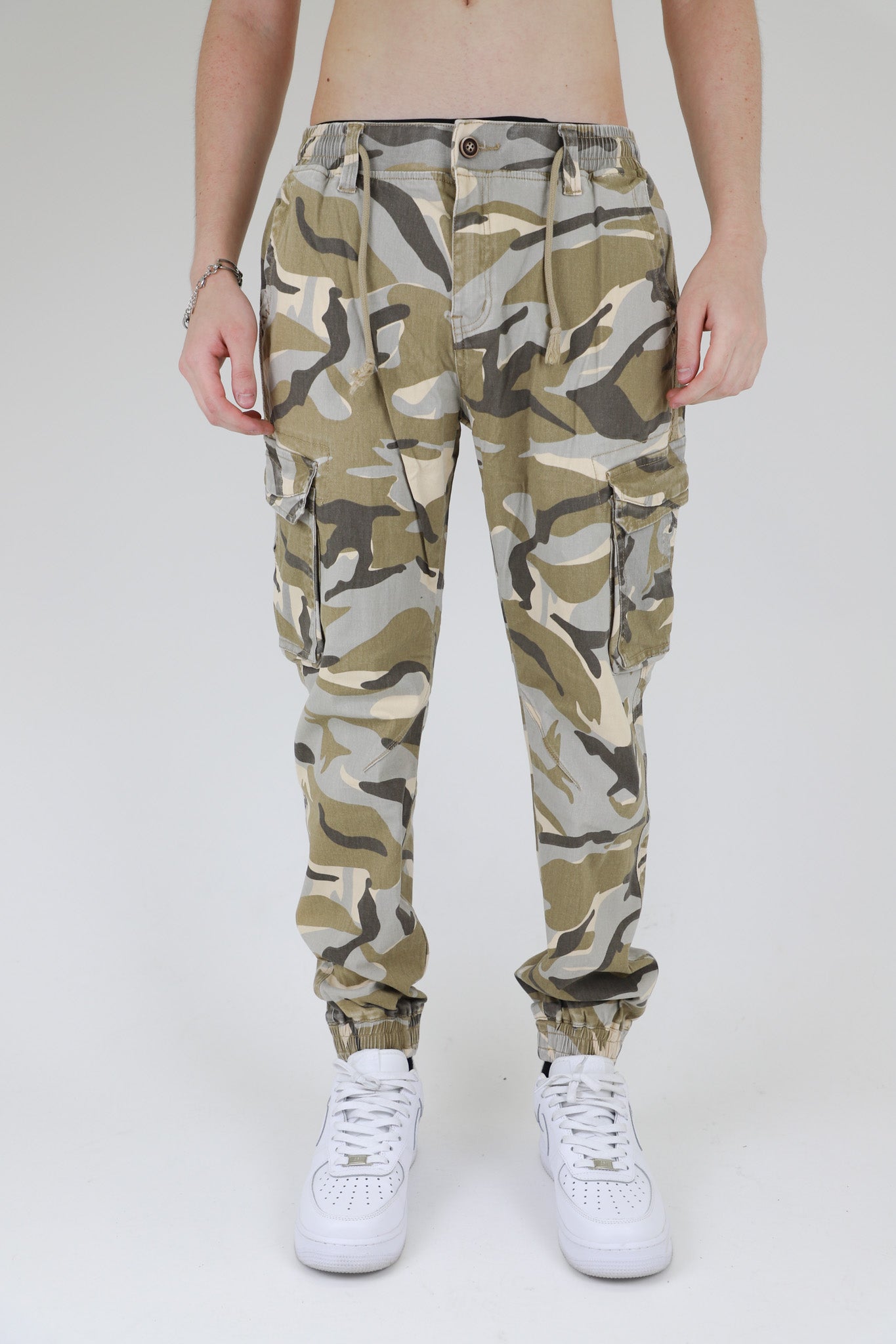 ARMOR JEANS AR1001 light camo cargo joggers pants with multiple pockets and relaxed fit, displayed on a hanger.