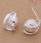 Silver-plated pearl earrings made of 925 silver, featuring elegant dangling pearls and a shiny finish.