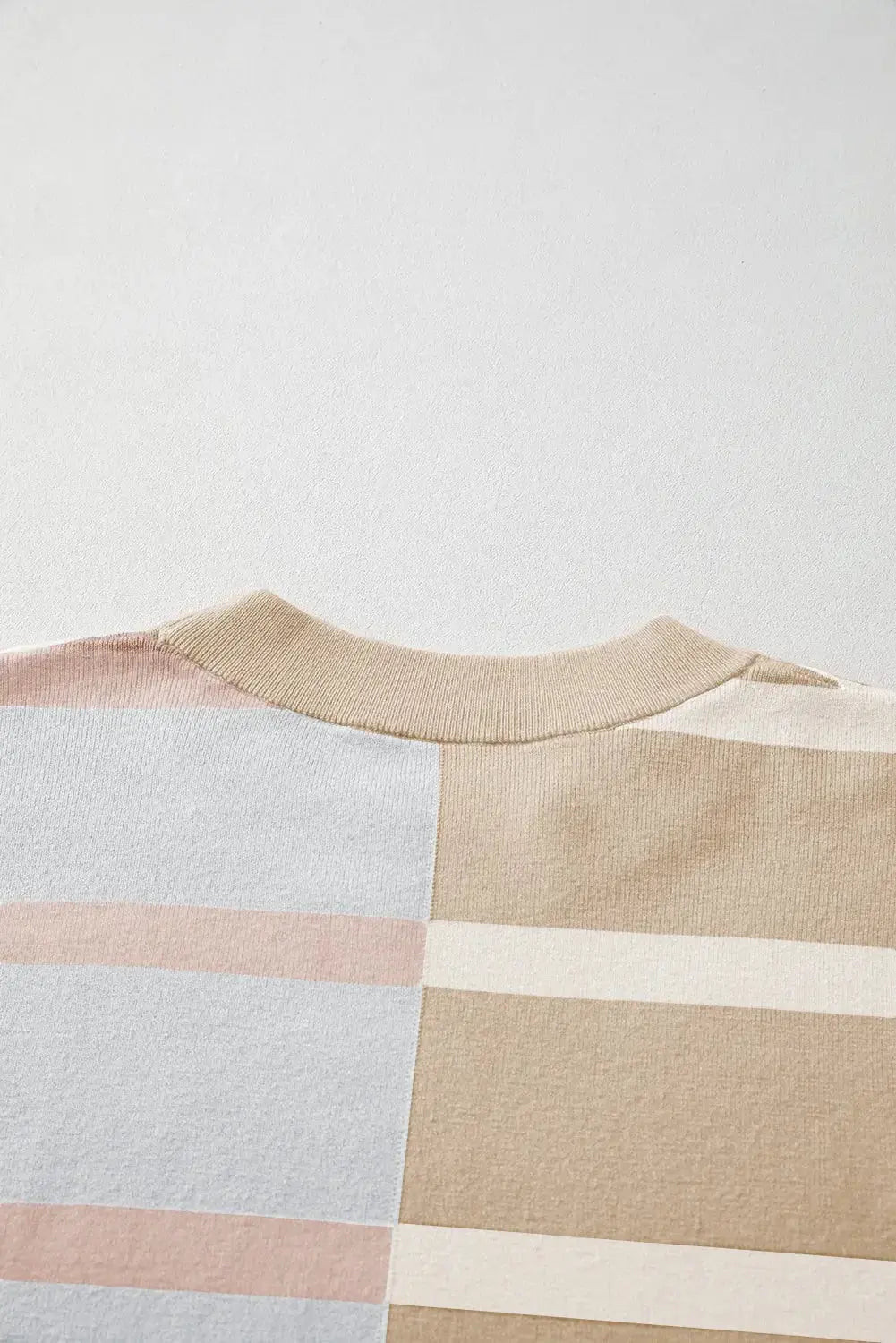 Colorful striped oversized sweater by Threaded Pear featuring bold colorblock design and cozy knit fabric.