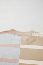 Colorful striped oversized sweater by Threaded Pear featuring bold colorblock design and cozy knit fabric.