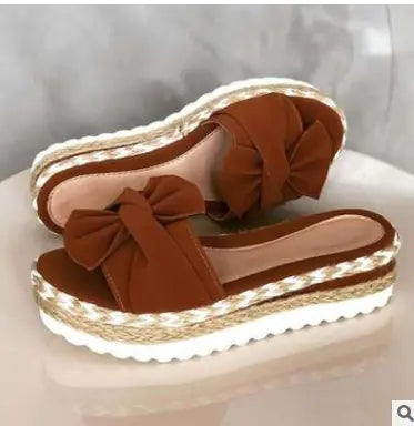 Women’s bow sandals with platform wedge heel by Trendy Attic Store01, featuring stylish straps and comfortable design.