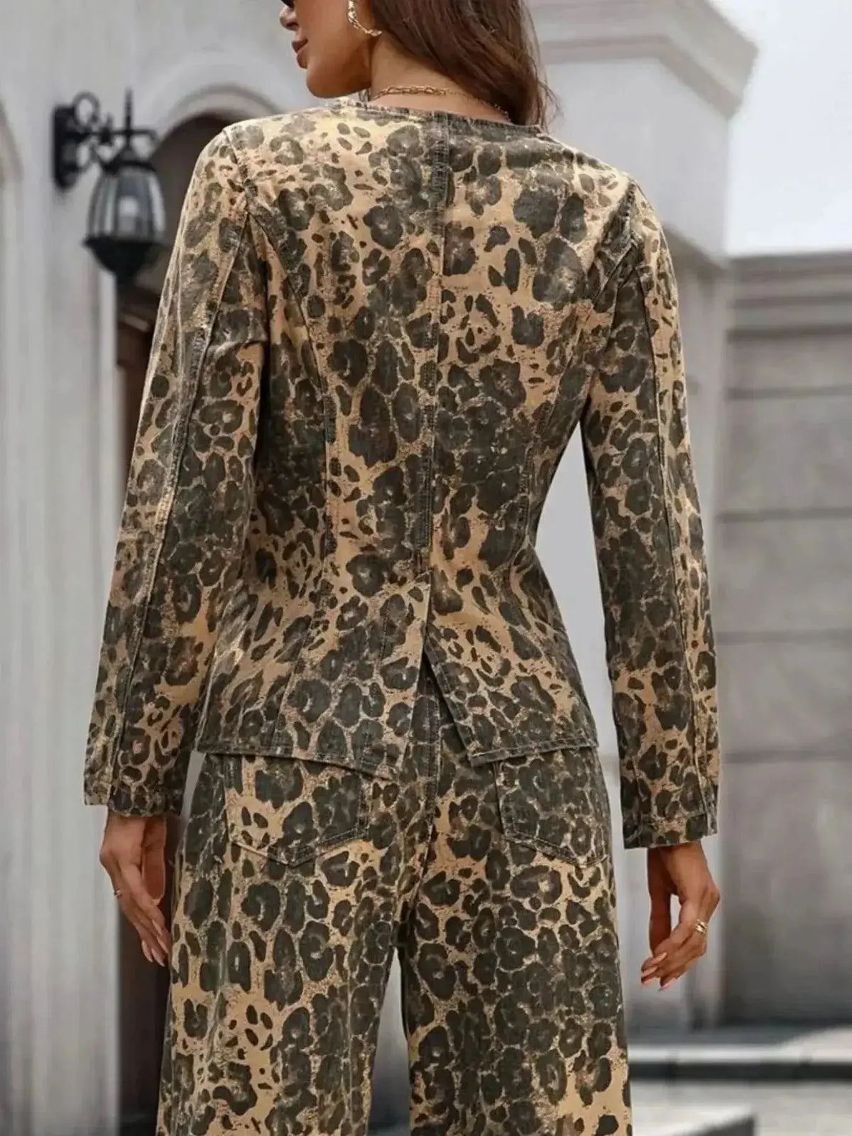 Women's long sleeve leopard print denim blouse by Plush Fashion Hub featuring a stretchy fabric and button-up front.