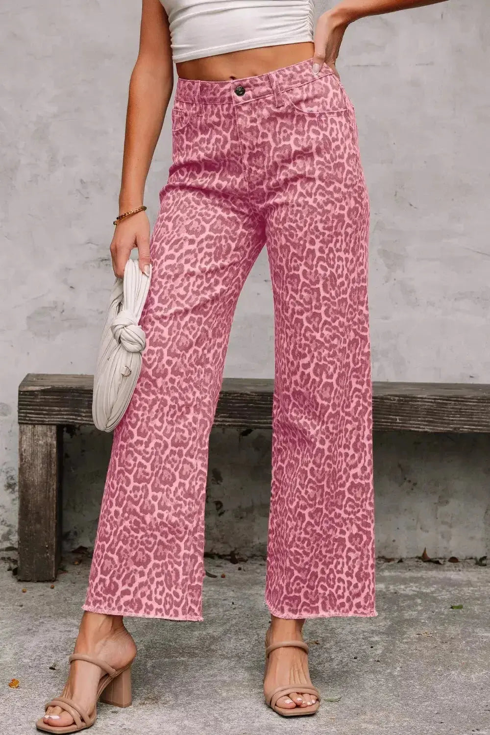 Leopard print high-waisted wide-leg jeans with frayed hem from Trendsi, shown with a relaxed fit and stylish pattern.