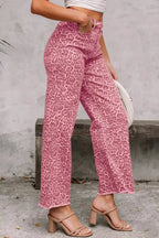 Leopard print high-waisted wide-leg jeans with frayed hem by Trendsi, showcasing stylish, relaxed-fit denim with bold animal print.