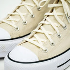 Elastic shoelace in Luxe Creme by Bread, with a close-up view of the soft, stretchy fabric and secure aglets.