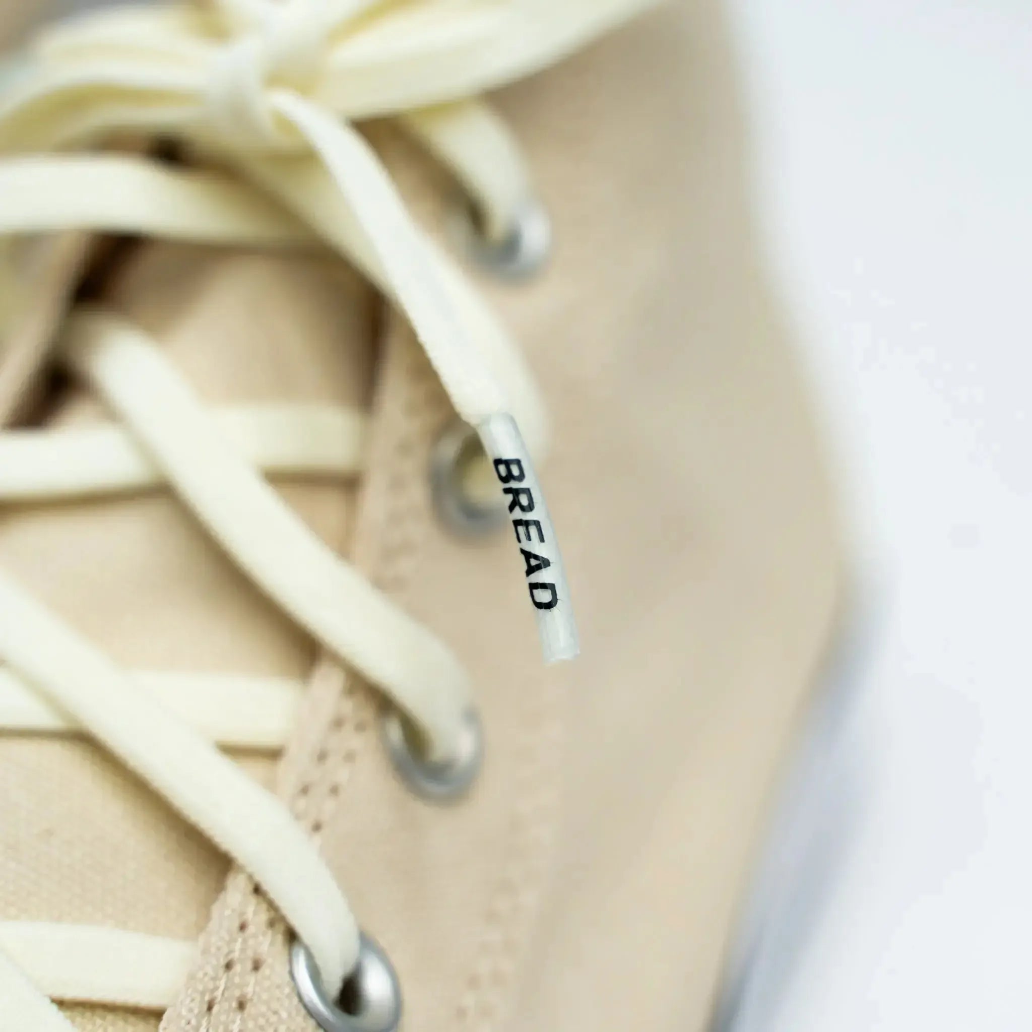 Elastic shoelaces in Luxe Creme color by Bread, featuring a sleek, smooth design suitable for enhancing footwear comfort.