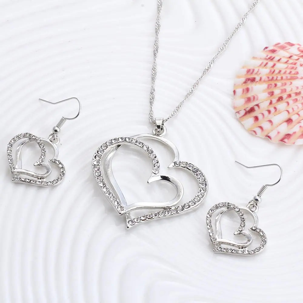 Plush Fashion Hub double heart wedding jewelry set featuring a necklace and matching earrings with elegant design.