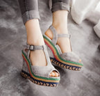 Women’s high heel wedge sandals with thick soles and stylish straps, designed for comfort and fashion.