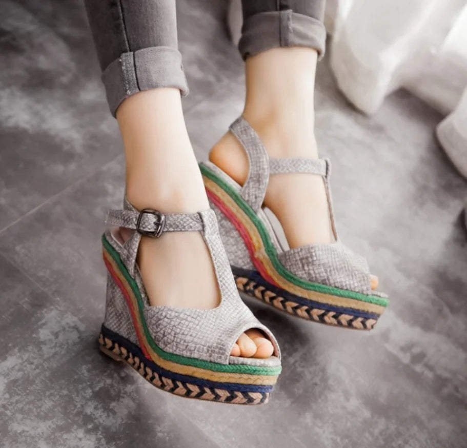 Women’s high heel wedge sandals with thick soles and stylish straps, designed for comfort and fashion.