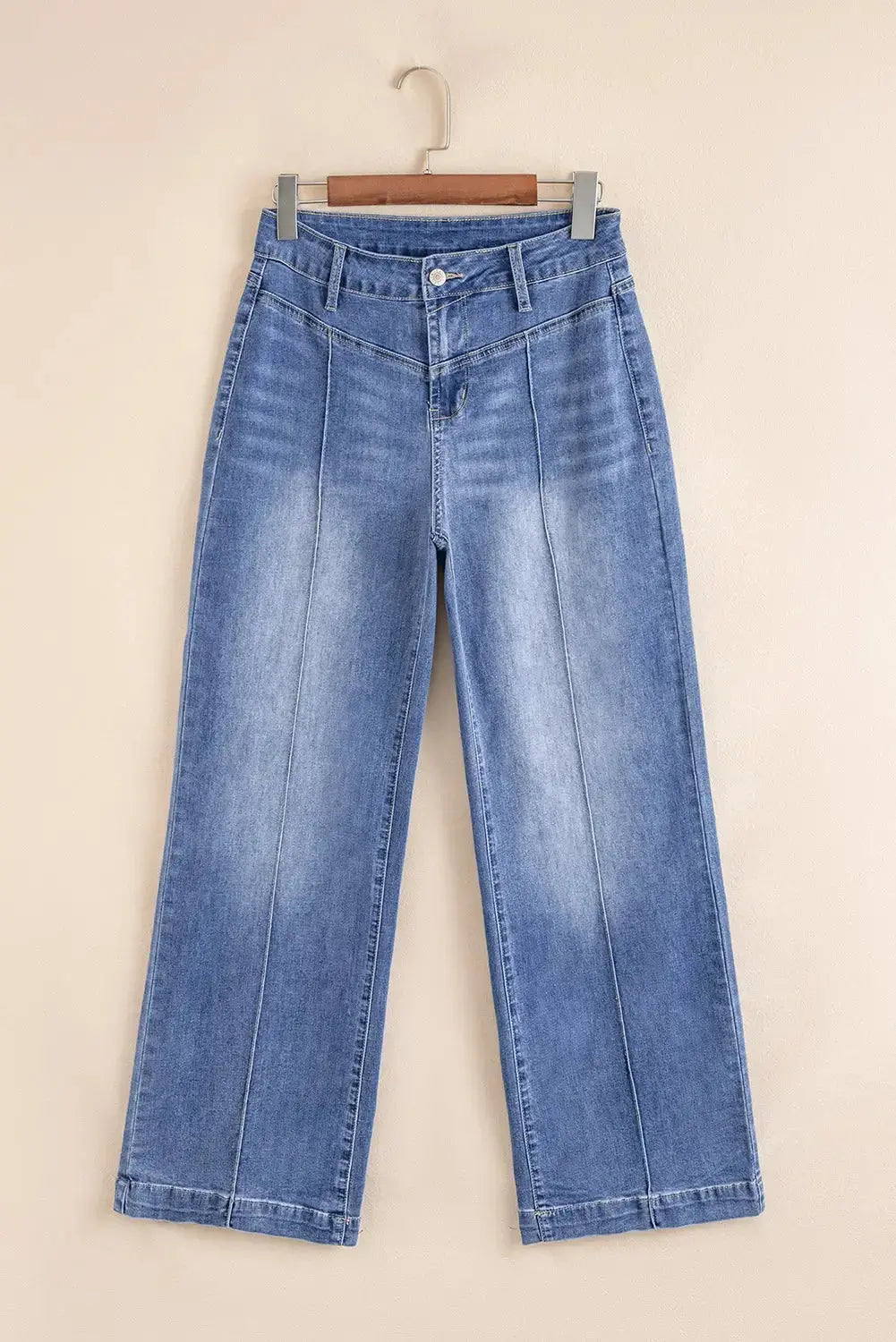 Light blue Megan loose high-rise jeans by Threaded Pear, showing relaxed fit and high waist style with subtle stitch details.