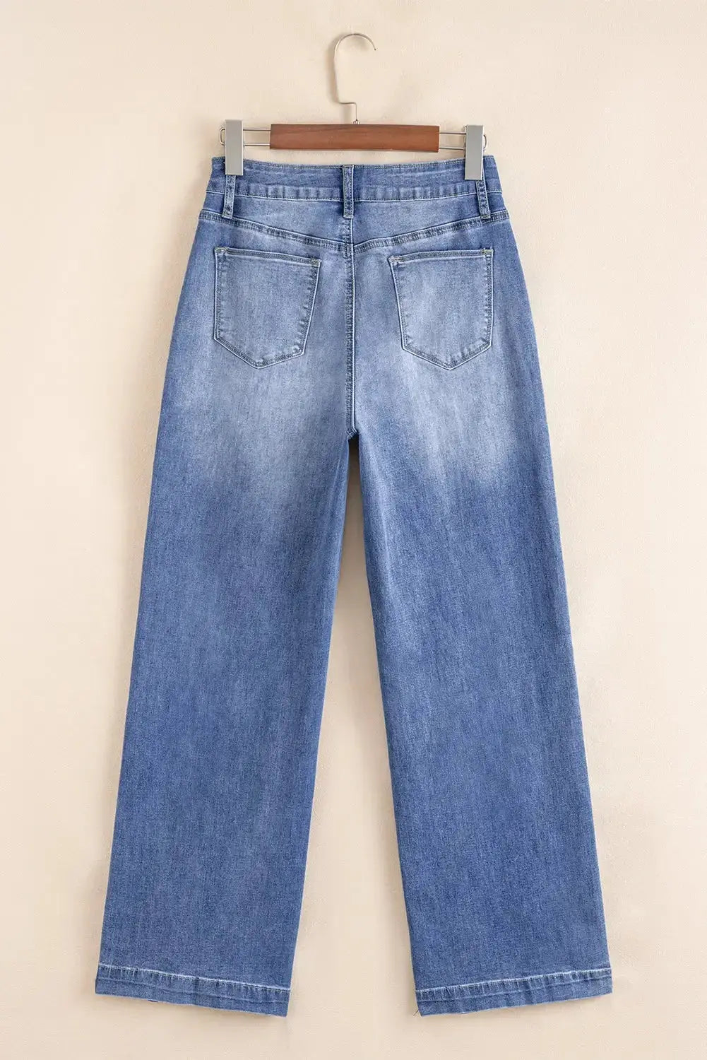 Light blue Megan loose high-rise jeans by Threaded Pear, showcasing relaxed fit and high waist style.