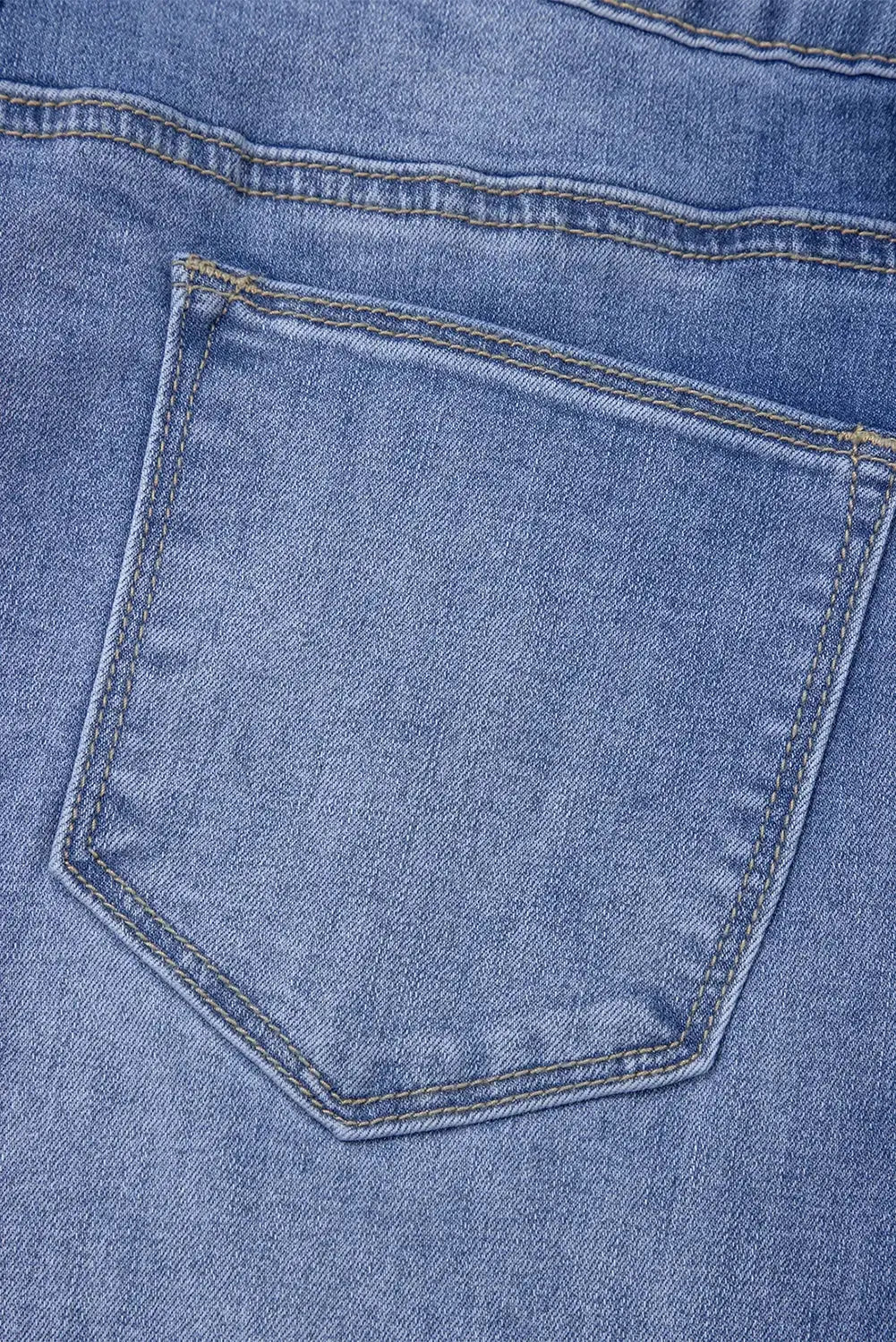 Light blue Megan loose high-rise jeans by Threaded Pear displayed on a model, showcasing relaxed fit and high waist style.