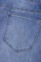 Light blue Megan loose high-rise jeans by Threaded Pear displayed on a model, showcasing relaxed fit and high waist style.