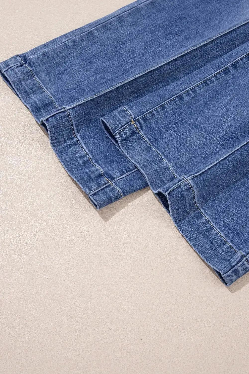 Light blue Megan loose high-rise jeans by Threaded Pear, showcasing relaxed fit and high waist on a mannequin.